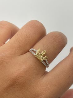 2D Crown Ring  -white CZ stones  -solid yellow gold crown  - available in size 7  -100% solid 14k gold  -will not tarnish, nor change color  -24/7/365 wearable  -sizing upon request. Ring are all final sales. -any questions please let us know  -item is sold by piece. Weight is undetermined. Gold Crown-shaped Diamond Ring, Gold Crown Shaped Diamond Ring, Gold Diamond Ring With Crown Design, Gold Crown Design Diamond Ring In 14k Gold, Gold Cubic Zirconia Crown Ring, 14k Gold Crown Design Diamond Ring, Gold Diamond Ring With Crown Design In 14k, Fine Jewelry Yellow Gold Crown Design Ring, White Gold Crown Design Rings In 14k Gold