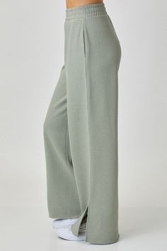 Change up your loungewear game with the Wendy Wide Leg Lounge pants. Crafted from a luxuriously soft 55% cotton/45% Polyester blend, these chic-yet-effortless pants feature a high 11.75" rise and 29.75" inseam that let you move with ease and comfort. With a look that's both relaxed and refined, you'll be in lounge-ready mode in no time. Ready to upgrade your loungewear? Model Info: Height 5'8" | Waist 24" | Hips 34 Versatile Loungewear Pants, Versatile Full-length Loungewear Pants, Comfortable Spring Pants For Relaxation, Chic Full-length Sweatpants With Elastic Waistband, Comfortable Pants For Relaxation And Spring, Spring Relaxation Comfortable Pants, Chic Wide Leg Solid Color Sweatpants, Fall Bottoms With Pockets For Relaxation, Fall Casual Bottoms With Pockets