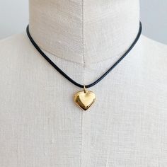 This Black Cord Heart Drop Necklace is a timeless addition to your jewelry collection. Featuring a fashionable black cord chain and dimensional rounded heart pendant, this necklace will be the perfect accent to any outfit. With its versatility and class, it's sure to impress.Dimensions: approximately 16" cord with a 2" extender, heart charm is approximately 0.6" x 0.5"plated stainless steel, water and tarnish freeLead and Nickel freeMaterial Composition: plated stainless steel Gold Drop Necklace, Silver Drop Necklace, Black Cord Necklace, Everyday Gifts, Cord Necklace, Drop Necklace, Scrunchie Hairstyles, Steel Jewelry, Stainless Steel Jewelry