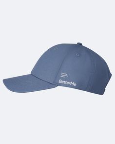 a blue baseball cap with the words better me printed in white on the front and bottom