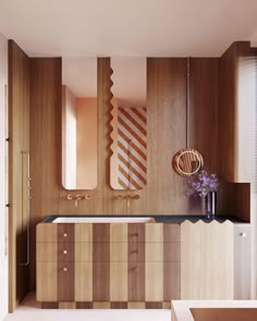 a modern bathroom with wood paneling and an unusual mirror on the wall above the sink