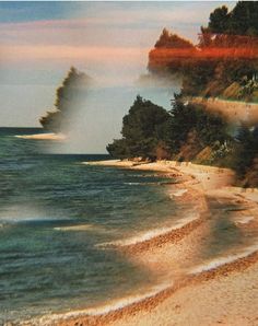 an image of a beach with waves coming in from the water and trees on the shore