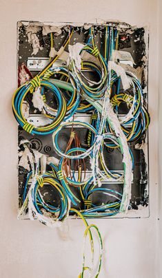 an electrical panel with multiple wires attached to it