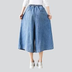 Take your laid-back trend to a whole new level with our 2023 Spring-Summer Collection of short culottes denim pants! These high-waisted. medium wash pants feature drawstrings closure for a unique and stylish look. Enjoy the perfect balance of comfort and trendy with these amazing culottes!Distinctive Features: Street vibe for a one-of-a-kind look Medium wash for a conventional chic look High-rise for a flattering fit Drawstring closure for added style and convenience Style and Comfort CombinedOu Trendy Knee-length Bottoms With Pockets, Spring Baggy Medium Wash Cropped Jeans, Casual Medium Wash Wide-leg Cropped Jeans, Spring Baggy Knee-length Bottoms, Knee-length Jeans With Pockets For Summer, Trendy Knee-length Denim Bottoms, Knee-length Jeans For Spring, Summer Cotton Culottes With Straight Leg, Summer Straight Leg Cotton Culottes