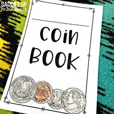 a book with coins on it and the words coin book written in black ink next to them