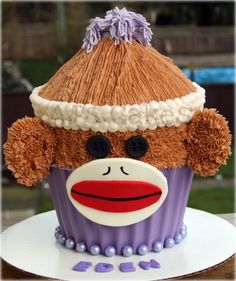 there is a cupcake decorated like a sock monkey