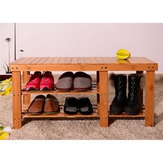 a wooden shoe rack with shoes on it