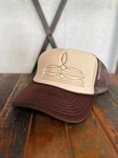 Boot Stitch Embroidered Trucker Hat Trendy Brown Trucker Hat With Short Brim, Brown Short Brim Trucker Hat For Spring, Spring Brown Trucker Hat With Short Brim, Embroidered Adjustable Trucker Hat, Brown Trucker Hat With Short Brim For Spring, Brown Flat Brim Trucker Hat For Spring, Trendy Brown Hat With Embroidered Logo, Retro Brown Snapback Hat With Short Brim, Brown Trucker Hat With Short Brim