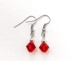 "These beautiful red earrings are made with 8mm red bicones and 4mm sterling plated round beads with nickel free ear wire. Earrings measure 1 1/4\" long. Perfect gift idea for anyone or bridesmaid gift." Red Necklace, Jewelry Techniques, Red Earrings, Diy Crafts Jewelry, Wire Earrings, Matching Necklaces, Earrings Etsy, Star Earrings, Bridesmaid Gift