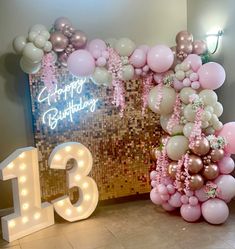 balloons and streamers decorate the entrance to a 13th birthday party