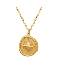 a gold compass pendant on a chain