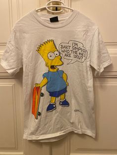 a white t - shirt with the simpsons saying bart simpson is here but he's hot