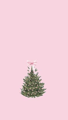 a small christmas tree with pink bows on it's head, against a light pink background