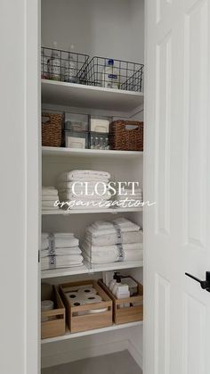 an open closet with white linens and baskets on the shelves, labeled closet organization