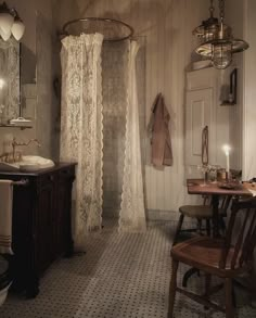 a bathroom with a sink, mirror and shower stall in the middle of the room