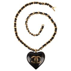 Chanel - (Made in France) Golden metal necklace with black leather and a wood heart topped with a cc logo. Spring-Summer 1992 Collection. Additional information: Condition: Very good condition Dimensions: Length: 76 cm Period: 20th Century Seller Reference: CB186 Heart Accessories, Metal Necklace, Heart Top, Wood Hearts, Chanel Black, Cc Logo, Black Ribbon, A Wood, Metal Necklaces