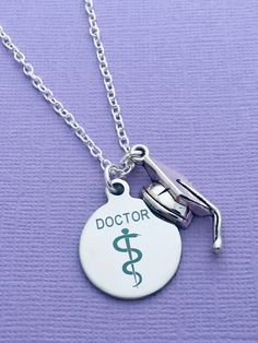 a doctor necklace with a medical symbol on it