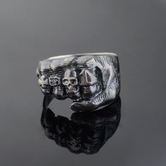 P R O D U C T ∙ D E S C R I P T I O N 925 Sterling Silver. This Hand Made Ring is designed for those who crave a bold, distinctive accessory that speaks to their unique style. Featuring a meticulously detailed skeleton fist design, this ring embodies a sense of power and resilience, perfect for bikers, rockers, and anyone who appreciates striking jewelry. Our Silver Punching Fist Ring is not just a statement piece; it's a symbol of strength and individuality. The Antique finish adds a vintage ch Black Punk Skull Ring Collectible, Black Sterling Silver Punk Rings, Black Punk Style Skull Ring Collectible, Black Biker Style Ring As Gift, Black Biker Skull Ring Gift, Black Biker Style Skull Ring As Gift, Collectible Symbolic Black Skull Ring, Black Biker Rings For Biker Events, Black Sterling Silver Skull Ring Hand Cast