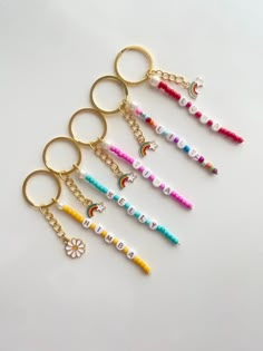 six keychains with the word love written in different colors and designs on them