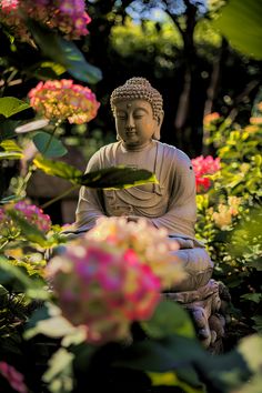 a buddha statue sitting in the middle of flowers