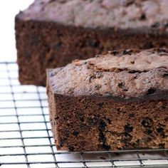 two slices of chocolate banana bread on a cooling rack