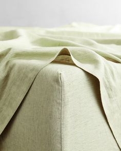 a close up view of the fabric on a bed