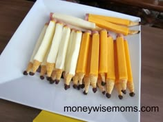 five pieces of cheese are lined up on a cutting board with the words food diary written above them