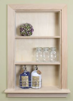 a shelf with bottles and soaps on it