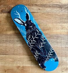 a skateboard with an image of a rabbit on it