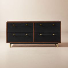 a black and gold dresser with two drawers