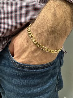 ➣ High quality 10K Yellow Gold 8.5 inch Lite Figaro Chain Bracelet, 5.4mm 6.6mm Wide, Real Gold Bracelet, Unisex, Men's Gold Bracelet ➣ MATERIAL: 14K Yellow Gold  ➣ Closure: Lobster Clasp   ➣ Solid / Hollow: Hollow  ➣ Weights:  5.4 mm - 3gram,  6.5 mm - 4.1gram (video featured)    ◈ Please note that weights are approximate. ➣ If you need a specific length, please message us. Explore more gold bracelets. https://www.etsy.com/shop/MarinaMJewelry?ref=seller-platform-mcnav&search_query=gold+bracelet ➣ SHIPPING: ◈ We always offer domestic FREE SHIPPING via USPS first class (3-5 business days)  ◈ We ship internationally, shipping costs are shown at checkout.     Please be aware that the buyer is responsible for any international customs & duties. ◈ Orders shipped from NYC usually within 24-48 ho Gold Bracelets For Men 10 Gram, Real Gold Bracelet, Gold Arm Band, Wedding Jumpsuit, Gold Vermeil Jewelry, Gold Armband, Mens Gold Bracelets, Figaro Chains, Figaro Chain