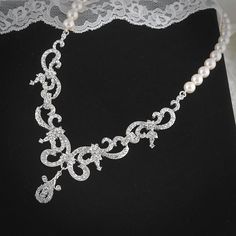 NINETTE, Bridal Necklace, Vintage Style Wedding Necklace, White or Ivory Swarovski Pearl and Rhinestone Statement Bridal Wedding Jewelry. $110.00, via Etsy. Ornate Bridal Necklace With Intricate Design For Wedding, Elegant White Bridal Necklace With Intricate Design, Elegant Bridal Necklace With Intricate Design In White, Ornate Crystal Necklace For Wedding, Ornate Crystal Wedding Necklace, Elegant White Bridal Accessories With Intricate Design, Elegant Bridal Sets With Intricate Design For Wedding, Exquisite Silver Bridal Earrings For Wedding, Elegant White Bridal Set