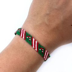 Let celebrate love and joy in Christmas time with this cute candy cane friendship bracelet! Red, green and white are perfect colors for Christmas!  Great idea for gift for someone special for you.  All my bracelets are made in smoke-free and pet-free environment. SIZE: Lenght (pattern part): 15 cm (5.9 inches) Width: 0.8 cm(0.31 inches) **Please take note: the colors of the product may vary due to different screen representations of the online photos.  Looking for that bracelet but in another co Christmas Friendship Bracelets, Green Friendship Bracelet, Bracelet Christmas, Cute Candy, Christmas Bracelet, Gift For Daughter, Personalized Bracelets, Braided Bracelets, Friendship Bracelet