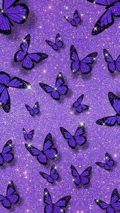 purple butterflies are flying in the air on a purple glittery background with sparkles