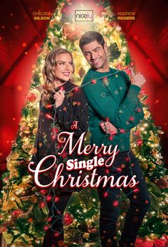 a merry single christmas poster with a man and woman standing in front of a christmas tree