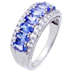 Exude timeless elegance with this Tanzanite Gemstone Band Ring from the Hidden Gems collection. Rhodium plated 925 stamped sterling silver is polished to achieve maximum comfort and a mirror-like finish.Fit for any occasion, adds the simple sophistication we all desire.All stones are natural gemstones.Hidden Gems Jewelry is a US-based company and we strive to provide the best quality service for all our customers. All our jewelry is new and inspected for quality assurance. 100% satisfaction guar Birthday Gemstones, Tanzanite Stone, Sterling Silver Rings Bands, Tanzanite Gemstone, Blue Tanzanite, Gems Jewelry, Sterling Silver Bands, Ring Sterling Silver, Hidden Gems