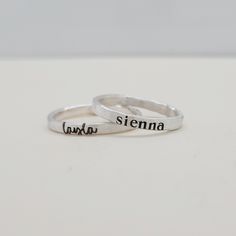 Mother's Day Gift | This personalized stacking ring features a unique and stylish handwriting font or serif font, adding a personal touch to your jewelry collection. Handmade with care, each ring is crafted with fine silver materials for a luxurious look and feel. Make a statement with this modern and customizable piece. Includes one name ring in your choice of font. Adjustable Engraved Name Ring As Gift, Minimalist Custom Name Adjustable Ring, Personalized Silver Engraved Ring For Mother's Day, Meaningful Personalized Adjustable Stackable Rings, Customizable Adjustable Minimalist Engraved Ring, Personalized Adjustable Meaningful Stackable Rings, Custom Name Adjustable Rings As Gift, Adjustable Custom Name Rings As Gifts, Minimalist Engraved Ring With Custom Name For Gift