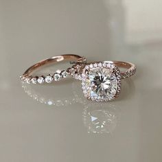 two engagement rings with diamonds on them