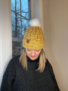 Bulky beanie, yellow winter hat with faux-fur pom Mustard yellow adult women's winter beanie hat with removable pom. Felted yarn gives a unique and stylish look.  Stay cozy and stylish with a hat handmade just for you! This warm hat is perfect for the coldest days, thanks to its blend of acrylic, wool and nylon yarn. The acrylic makes it super washable, the wool makes it warm, and the nylon gives it some stretch for a perfect fit. If you'd like to choose your pom colour, feel free to let me know Felted Yarn, Felt Yarn, Winter Beanie Hat, Hat Handmade, Winter Hats Beanie, Women's Beanie, Winter Beanie, Fur Pom Pom, Stay Cozy