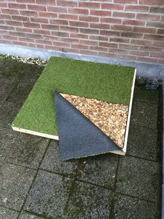 two pieces of artificial turf are laying on the ground