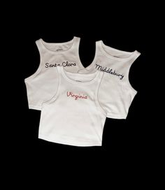 White cropped fitted tank tops with any phrase hand embroidered! The phrase will be embroidered exactly as written in the personalization section, so please make sure to use capital or lowercase letters as intended. Fitted Summer Tops With Embroidered Graphics, Fitted Letter Print Tank Crop Top, Fitted Tank Crop Top With Letter Print, Embroidered Fitted Casual Crop Top, Casual Embroidered Fitted Tank Top, Casual Embroidered Fitted Crop Top, White Embroidered Cotton Tank Top, Embroidered Stretch Cotton Tops, Casual Embroidered Sleeveless Crop Top