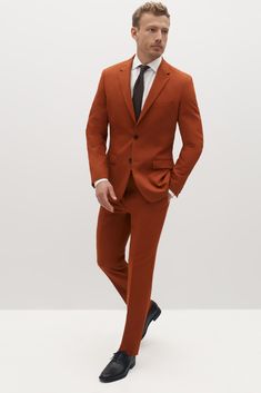 Suited for elegant statement-making and Street style alike, burnt orange is a bright way to liven up your look. Created in a rich, dark orange shade of terracotta, this men’s suit makes no compromises with style or personality and is perfect for any event. Burnt orange is crafted in our Eco Stretch fabric to give you flex where you want it and comfort where you need it. Orange Notch Lapel Blazer For Work, Tailored Orange Blazer With Notch Lapel, Fitted Orange Suits For Fall, Fitted Orange Outerwear With Notch Lapel, Tailored Orange Single-breasted Blazer, Orange Long Sleeve Formal Blazer, Classic Orange Blazer For Workwear, Classic Orange Blazer For Work, Brown Fitted Sport Coat For Formal Occasions