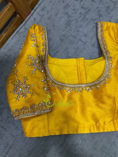 This is made to order/ custom made according to your requirements. Fabric - High quality rawsilk Color - Flaming Yellow Princess Cut Padded Deep U Front and Back Neck Front Hook Closure Half Sleeve Cotton lining This flaming yellow choli blouse is perfect for haldi ceremony. It's embellished with kundan stones and beads. Size : 32, 34, 36, 38, 40, 42 44 all sizes possible This is made to order product. We will send a measurement template once you purchase the item. You can provide measurements l Cheap Yellow Blouse Piece For Puja, Blouse For Haldi, Yellow Blouse Design, Yellow Choli, Net Puff Sleeves, Designer Bridal Saree, Yellow Blouse Designs, Bridal Saree Blouse, Golden Blouse