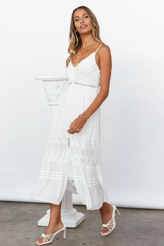 Length from bust to hem of size S: 110cm. White maxi dress. Lined. Cold hand wash only. Model is a standard XS and is wearing size XS. True to size. Lightweight, non-stretchy woven fabric. Buttons down front. Lace detailing throughout. No zipper. Slip-on style. Rayon. It's R&R time! Treat yourself and bask in the sun in our Catch Me By The Sea Maxi Dress White! Featuring lacy details and a floaty skirt, this will be your next summertime staple for breezy days by the water! Don't forget to show off your fresh tan, and style with your comfiest wedge sandals. Comfy Wedges Sandals, Nicole Fashion, Maxi Dress White, White Maxi Dress, Fabric Buttons, White Maxi, Floral Dresses, Hey Girl, White Maxi Dresses