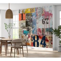 a dining room with a table and chairs in front of a large painting on the wall