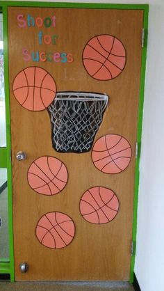 a door decorated with basketballs and the words shoot for success