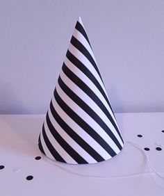 a black and white party hat sitting on top of a table