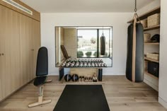 a home gym with punching bags and boxing gloves