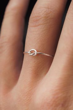 This stacking Knot ring is really cute and easy to wear! The open wire knot adds a bit of extra detail to this otherwise simple hammered stacking ring. This is one single length of metal that is knotted into a secure, open knot and soldered around the back. This ring is a great alternative to a stacking ring! This list Dainty Sterling Silver Open Ring Jewelry, Dainty Metal Open Ring Jewelry, Delicate Silver Open Ring Jewelry, Simple Ring Designs Silver, Minimalist Silver Open Ring Jewelry, Nickel-free Minimalist Sterling Silver Rings, Simple Ring Design, Delicate Silver Rings, Knot