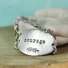 "It only takes one little word to touch someone's heart. And this inspirational word bracelet makes a memorable gift idea that your recipient is sure to cherish. ♥ Pewter Stamping Blank, Oval, 1 1/2\" x 7/8\" ♥ Silver plated chain - choose your length To order yours, choose your options and enter your details in the box. Add it to your cart. Choose your shipping method, and check out." Metal Stamping Ideas, Impress Art, Washer Bracelet, One Little Word, Infinity Charm Bracelet, Washer Jewelry, Custom Engraved Bracelet, Personalized Charm Necklace, Coordinates Bracelet